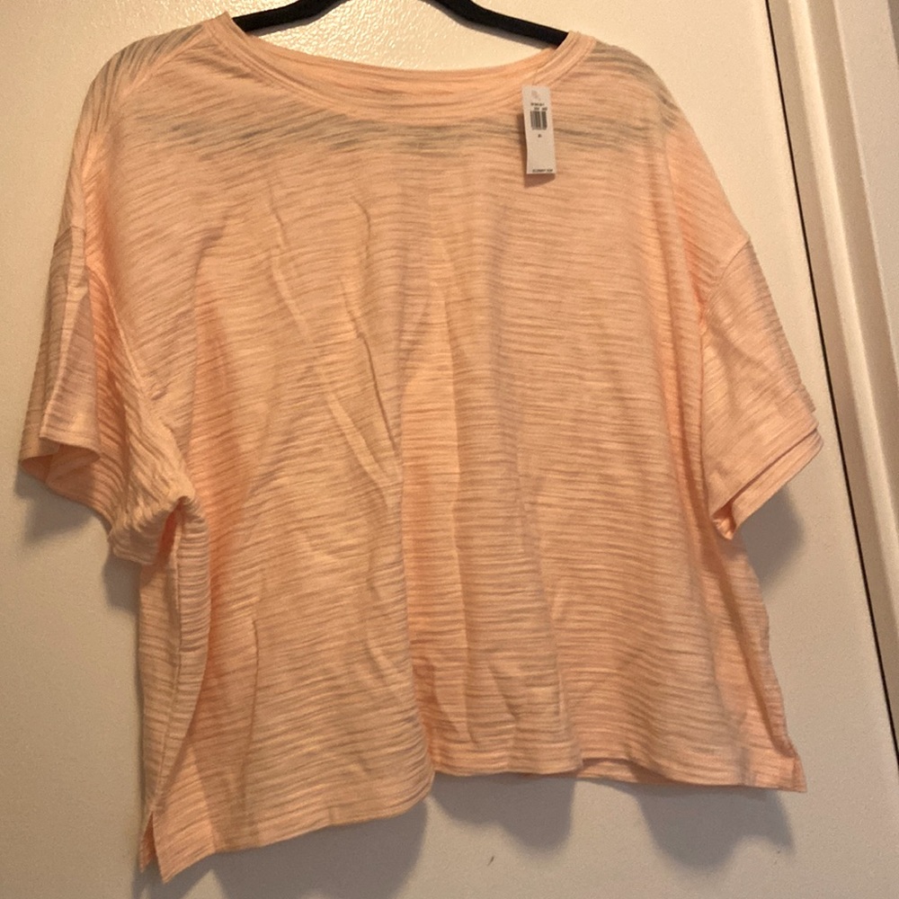 Textured light orange / pink crop top. Never worn, perfect condition.